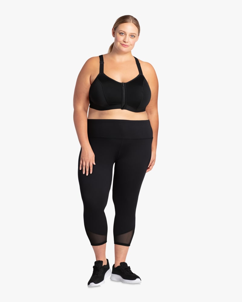 Plus size model with hourglass body shape wearing Provo Zip-Front Sports Bra by Addition Elle | Dia&Co | dia_product_style_image_id:114707